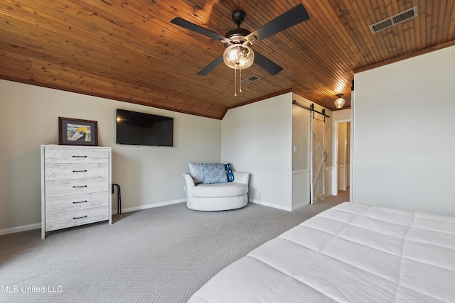 carpeted bedroom with ceiling fan, wooden ceiling, a barn door, and vaulted ceiling