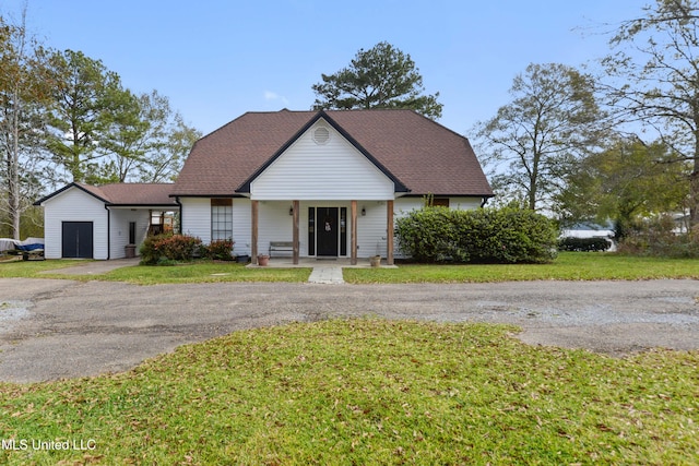 bungalow-style home with a front lawn