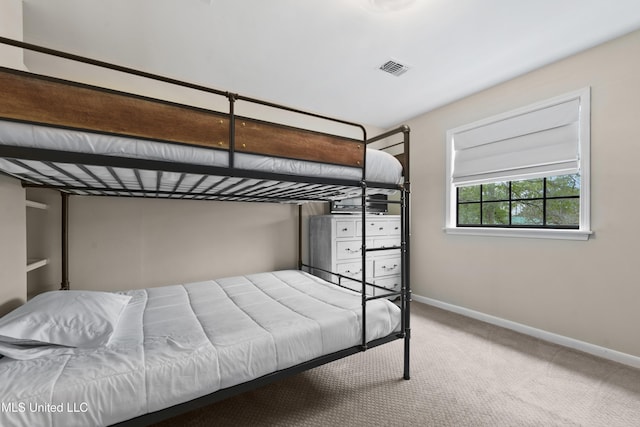 unfurnished bedroom with light colored carpet