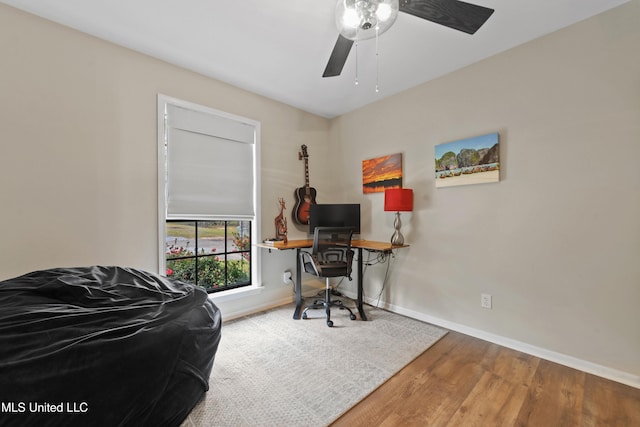 office space with hardwood / wood-style floors and ceiling fan