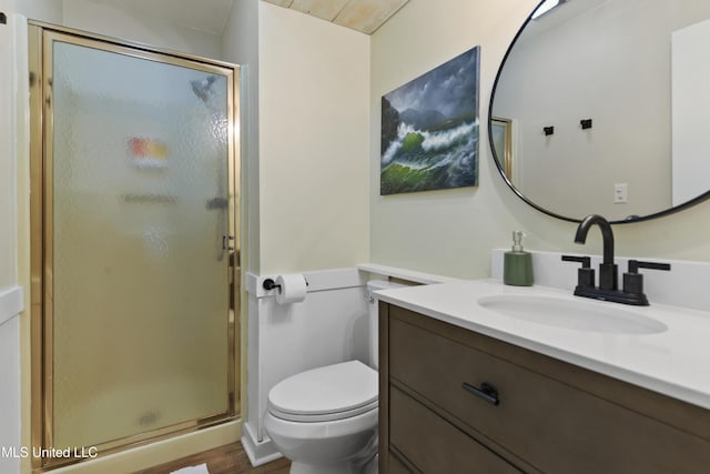 bathroom featuring toilet, walk in shower, and vanity