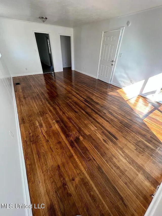 spare room featuring hardwood / wood-style floors