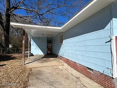 exterior space with a carport