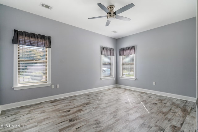 spare room with light hardwood / wood-style floors and ceiling fan