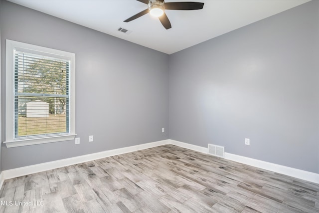 46 Tyro Rd, Holly Springs, MS 38635 - spare room with wood finished floors, visible vents, and a ceiling fan