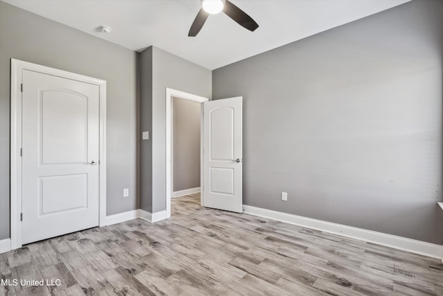 unfurnished bedroom featuring light hardwood / wood-style flooring and ceiling fan