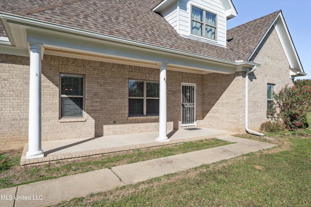 46 Tyro Rd, Holly Springs, MS 38635 - property entrance featuring roof with shingles and brick siding