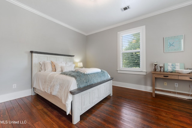 bedroom with dark wood-type flooring and crown molding