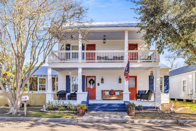 view of front facade featuring a porch and a balcony