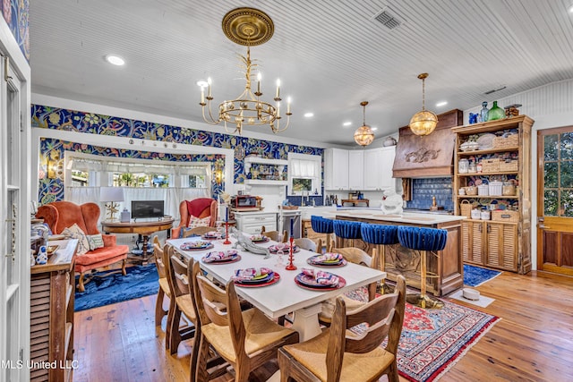 dining space featuring visible vents, a chandelier, light wood-style flooring, and recessed lighting