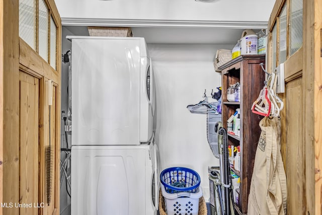 interior space featuring stacked washer and clothes dryer