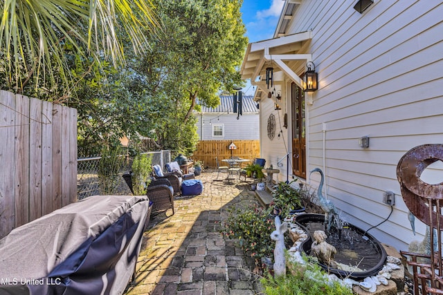 view of yard with a patio area and a fenced backyard