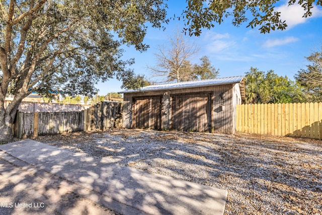 garage featuring fence