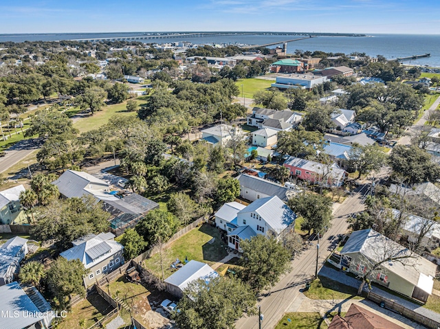 drone / aerial view with a water view and a residential view