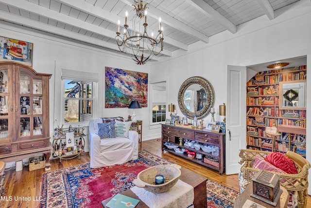 living area with wooden ceiling, a chandelier, and wood finished floors