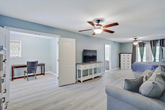 315 Wilson Welch Rd, Mendenhall, MS 39114 - living room with ceiling fan, light wood-type flooring, baseboards, a textured ceiling, and a desk