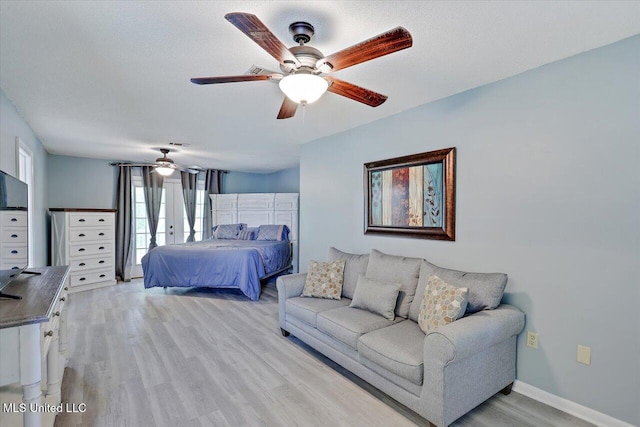 315 Wilson Welch Rd, Mendenhall, MS 39114 - bedroom with light wood finished floors, ceiling fan, and baseboards