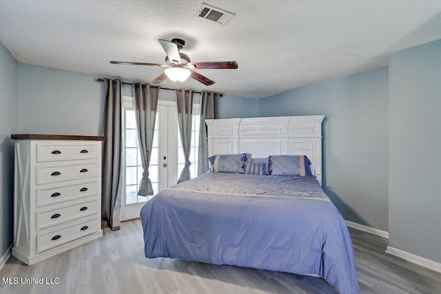 315 Wilson Welch Rd, Mendenhall, MS 39114 - bedroom with light wood-style floors, baseboards, a textured ceiling, and ceiling fan
