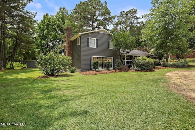 315 Wilson Welch Rd, Mendenhall, MS 39114 - rear view of house featuring a chimney and a lawn