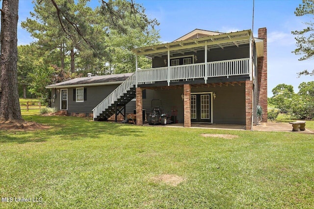 315 Wilson Welch Rd, Mendenhall, MS 39114 - rear view of property with stairs, a lawn, a wooden deck, and a chimney