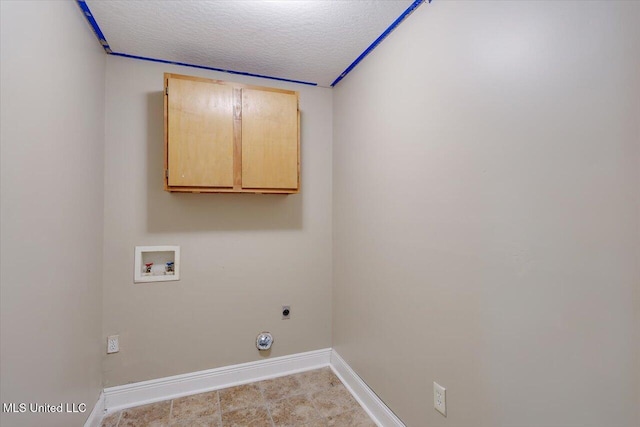315 Wilson Welch Rd, Mendenhall, MS 39114 - laundry room featuring cabinet space, hookup for a washing machine, baseboards, a textured ceiling, and electric dryer hookup