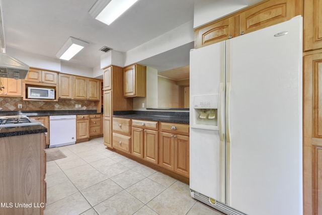 kitchen with backsplash, island range hood, white appliances, and light tile patterned floors