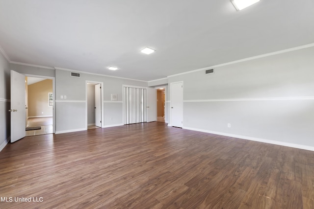 unfurnished room with crown molding and dark hardwood / wood-style floors