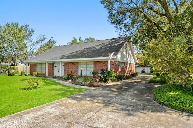 single story home with brick siding, a front yard, driveway, and roof with shingles