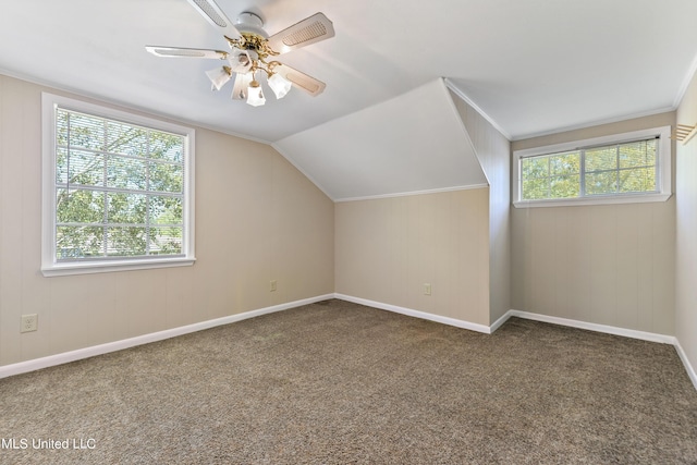 additional living space with a ceiling fan, carpet flooring, vaulted ceiling, and baseboards