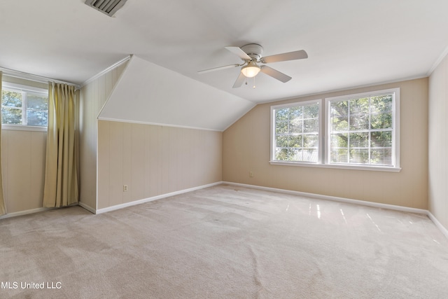 bonus room with light carpet, ceiling fan, and vaulted ceiling