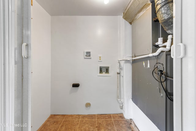 washroom featuring electric dryer hookup, washer hookup, and tile patterned flooring