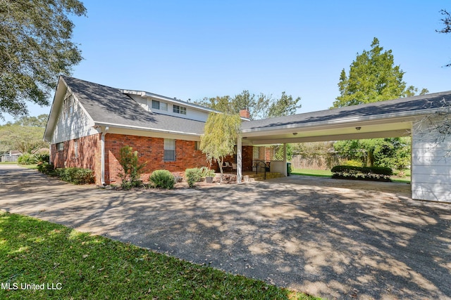 view of front of house featuring a carport