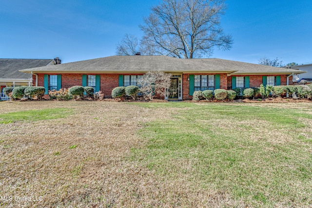 ranch-style house with brick siding and a front lawn