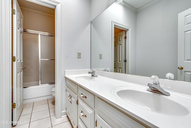 full bathroom featuring double vanity, crown molding, a sink, and tile patterned floors