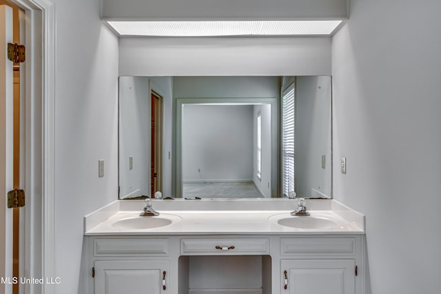 full bath featuring double vanity and a sink