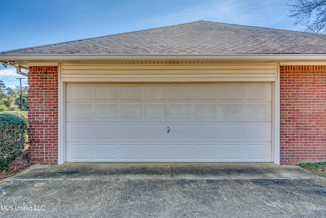 garage featuring driveway