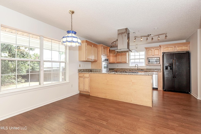 kitchen with hanging light fixtures, a textured ceiling, appliances with stainless steel finishes, island range hood, and dark hardwood / wood-style flooring