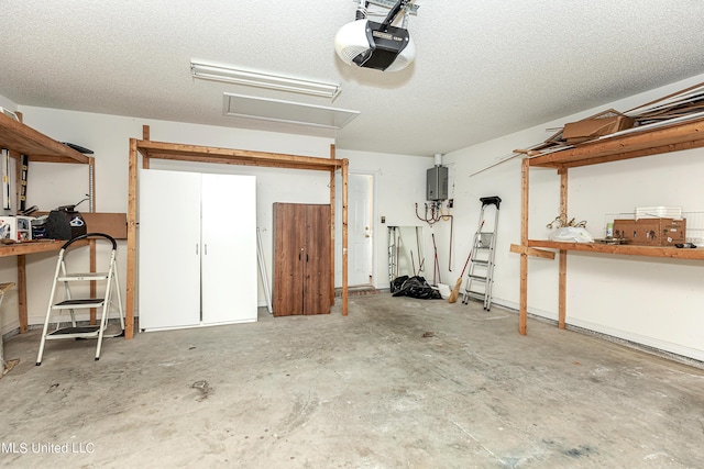 garage featuring electric panel and a garage door opener