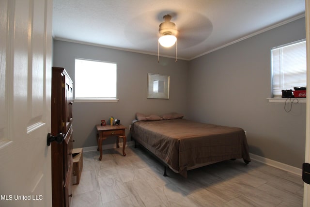 bedroom with ceiling fan and ornamental molding