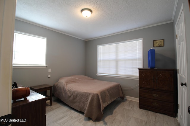 bedroom featuring a textured ceiling and ornamental molding