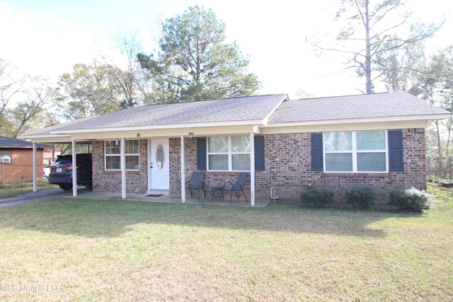 ranch-style home with a front yard and a carport