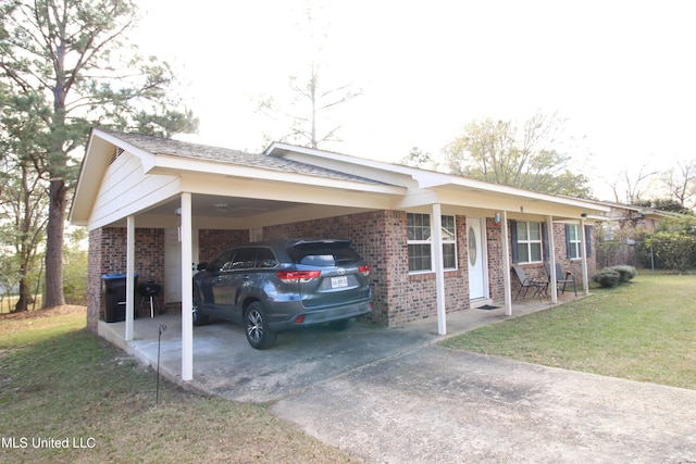 single story home with a carport and a front yard