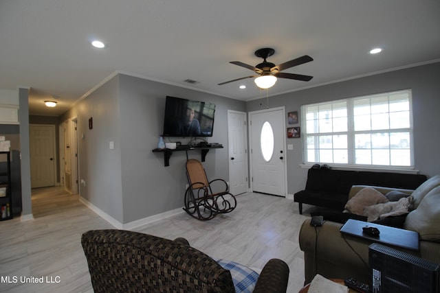 living room featuring ceiling fan and ornamental molding