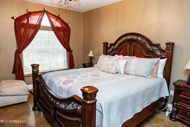 carpeted bedroom featuring a notable chandelier