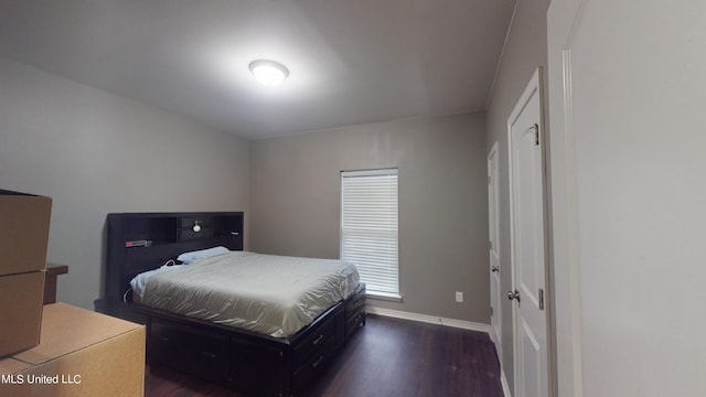 bedroom featuring dark hardwood / wood-style floors