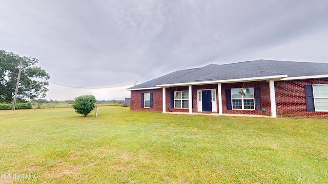 ranch-style home with a front yard