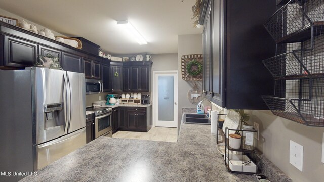 kitchen featuring stainless steel appliances and sink