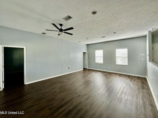 spare room with ceiling fan, dark hardwood / wood-style flooring, and a textured ceiling