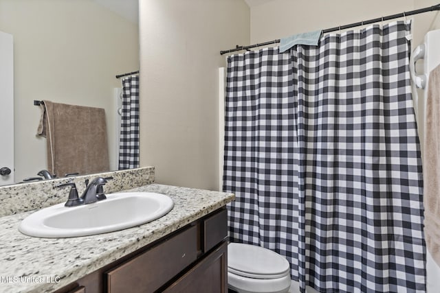 15035 Baylor Ave, Gulfport, MS 39503 - bathroom featuring toilet, vanity, and a shower with shower curtain