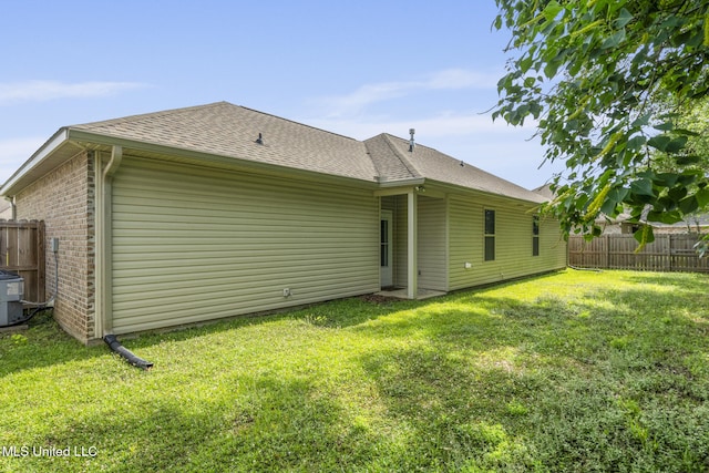 15035 Baylor Ave, Gulfport, MS 39503 - back of property with roof with shingles, brick siding, and central air condition unit